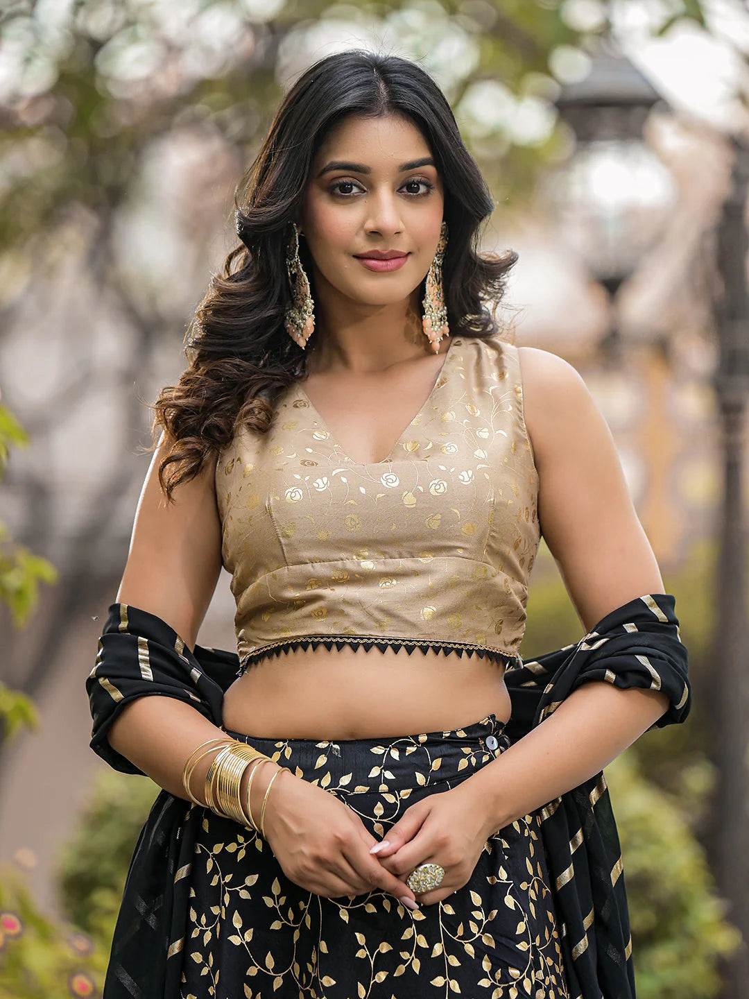 Woman wearing a traditional outfit with a blurred natural background